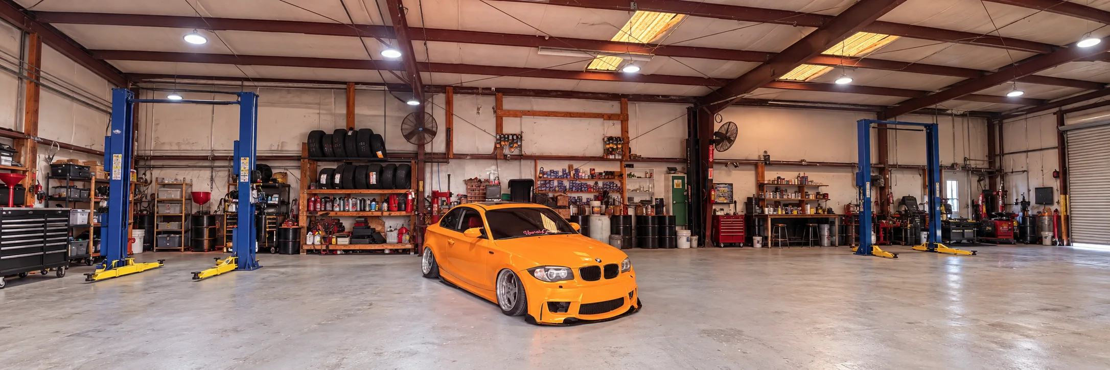 Cars and technicians inside the H&R Automotive shop